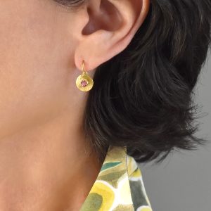 Alternative view of Neolithic hand-hammered disk earrings with rose cut tourmalines in 18k gold