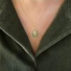 Egg pendant with Pegasus wing motif  in 18k textured gold and aventurine stone, chain sold separately