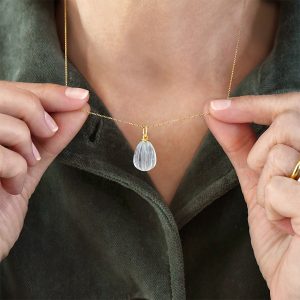 Alternative view of Εgg shaped rock crystal pendant with elegant twisted bail in 18k gold