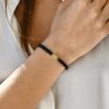 Cord bracelet with small evil eye motif in 18k gold and diamond center - Image 2